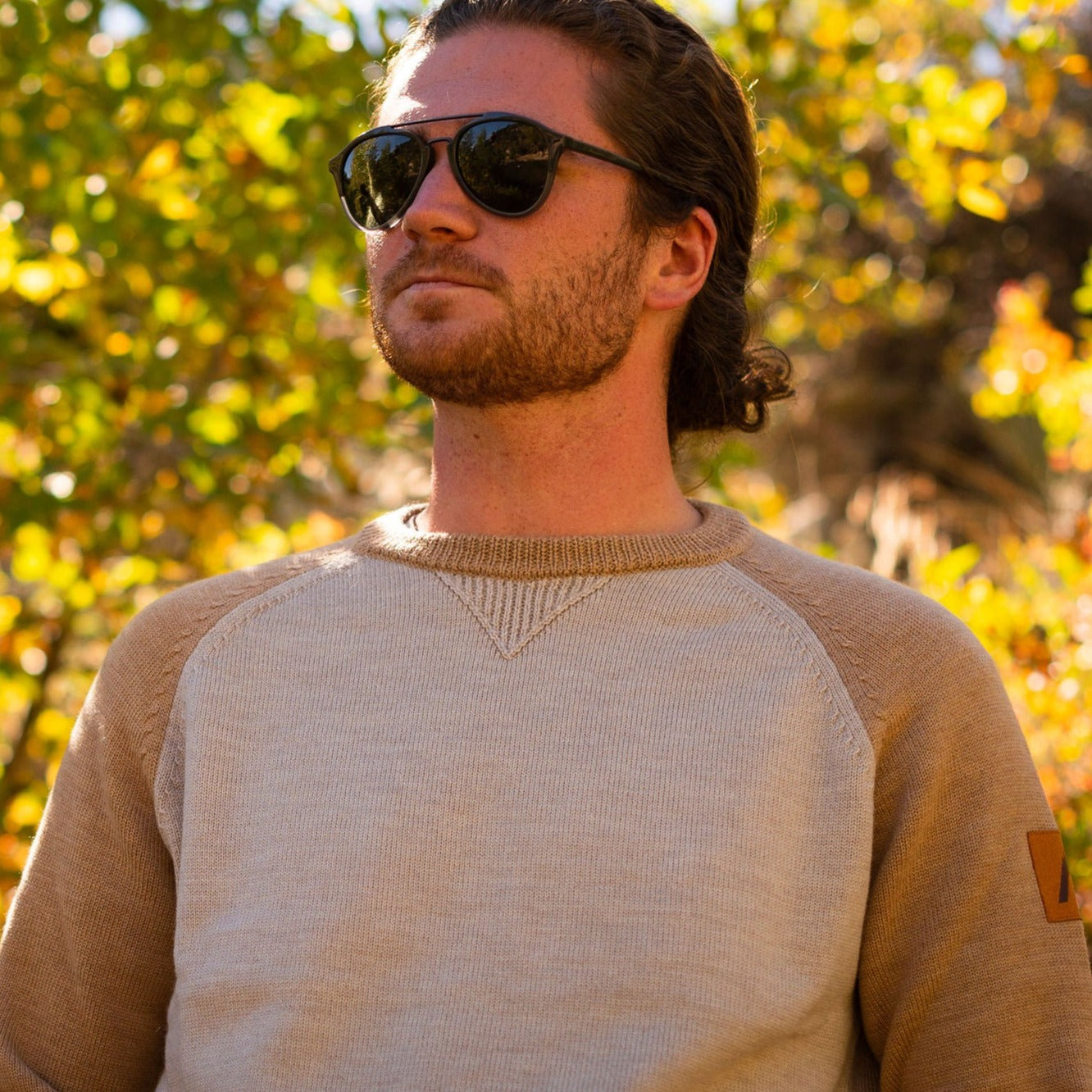 A comfortable classic in soft merino wool. Knitted in the United States with fine Italian merino wool yarn. The Colorado Sweater is sized unisex Details Made in the United States 100% merino wool Classic fit / high crew neck Contrast color raglan sleeve 2 colors: sand/tan, olive/taupe Unisex sizing