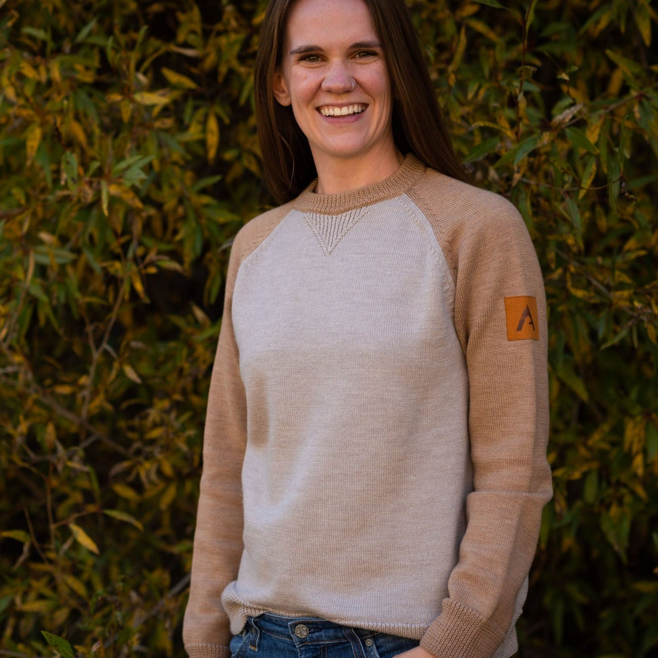 A comfortable classic in soft merino wool. Knitted in the United States with fine Italian merino wool yarn. The Colorado Sweater is sized unisex Details Made in the United States 100% merino wool Classic fit / high crew neck Contrast color raglan sleeve 2 colors: sand/tan, olive/taupe Unisex sizing