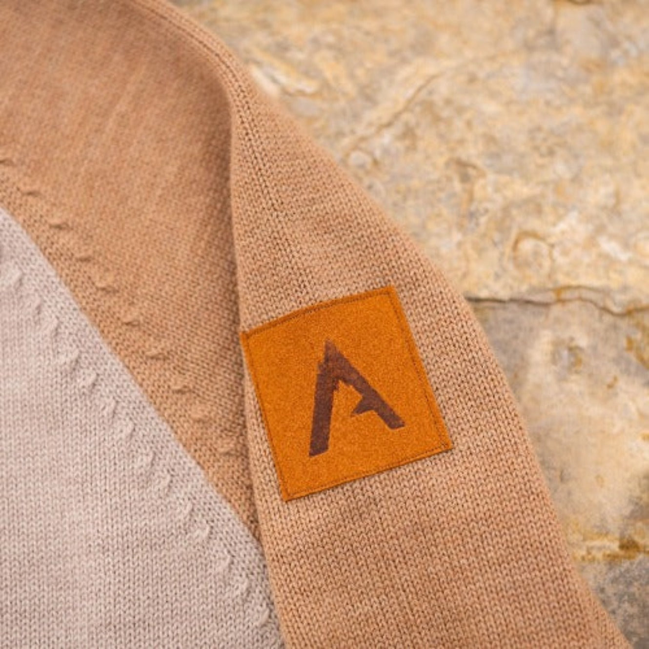 A comfortable classic in soft merino wool. Knitted in the United States with fine Italian merino wool yarn. The Colorado Sweater is sized unisex Details Made in the United States 100% merino wool Classic fit / high crew neck Contrast color raglan sleeve 2 colors: sand/tan, olive/taupe Unisex sizing