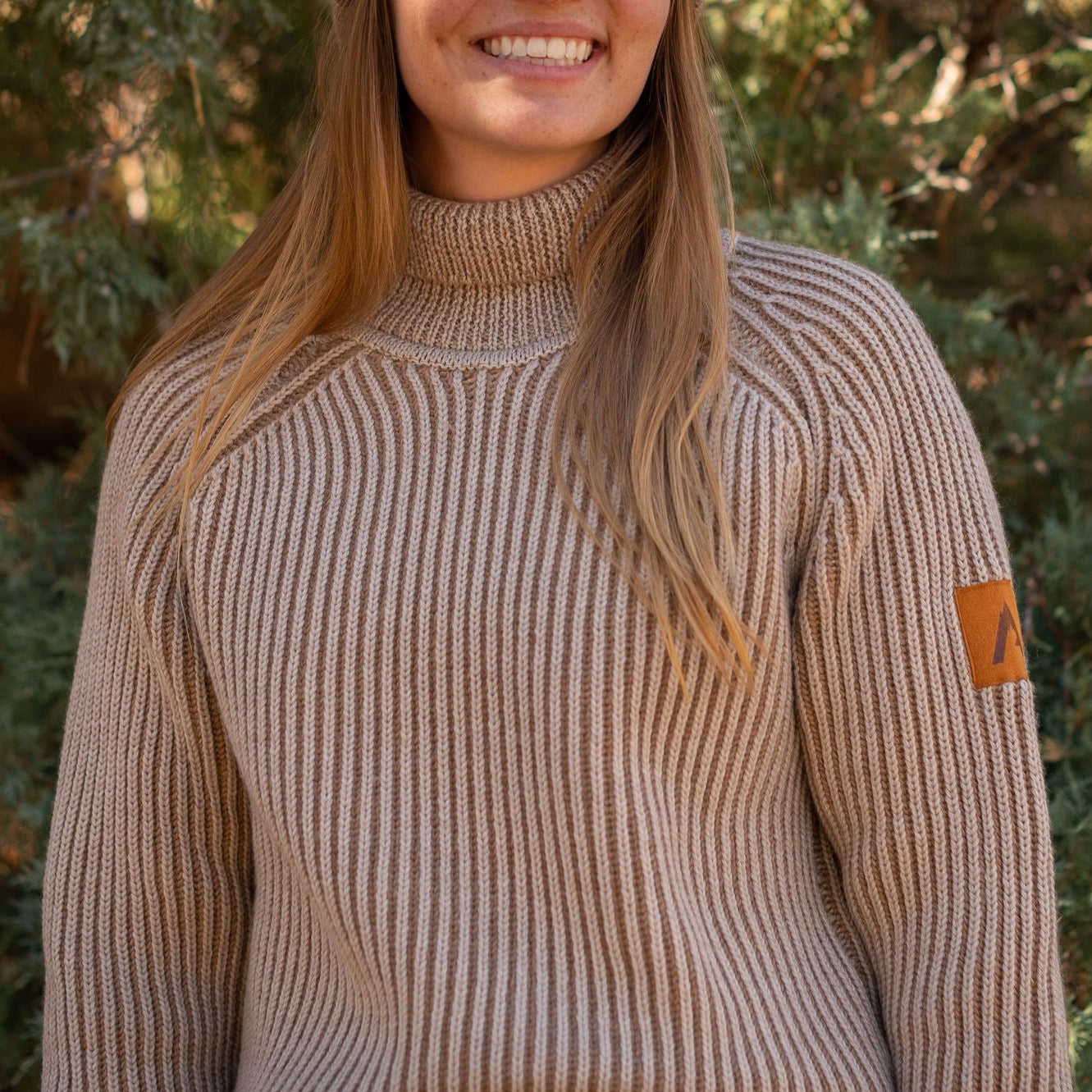 100% merino wool Cropped fit Turtleneck Raglan sleeve Ribbed cuff Made in the USA