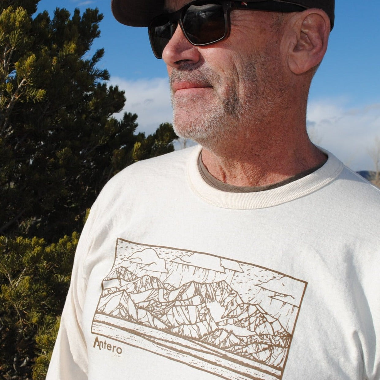 100% Organic Cotton Color | Natural Crew Neck Ribbed cuff Made in the USA Features artwork by local Salida CO artist Brinkley Messick