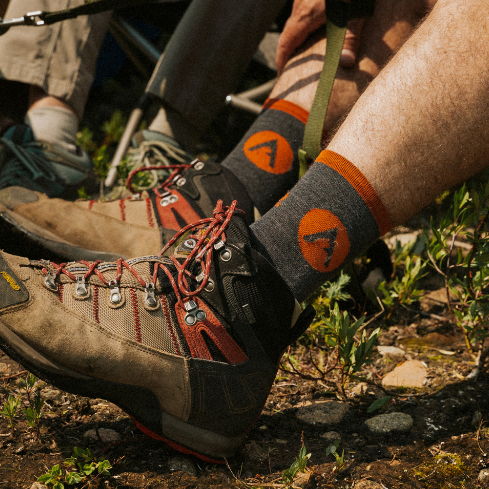 Enjoy every hike.  Padded soles for extra comfort.  Great breathability for post-hike cooling.     Details  70% Merino Wool 25% Nylon 5% Lycra  Cuff Height 5 Inches  Alpine Grey  Unisex  Made in the USA