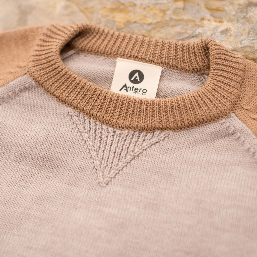 A comfortable classic in soft merino wool.  Knitted in the United States with fine Italian merino wool yarn.  The Colorado Sweater is sized unisex     Details  Made in the United States  100% merino wool  Classic fit / high crew neck  Contrast color raglan sleeve  2 colors:  sand/tan, olive/taupe  Unisex sizing